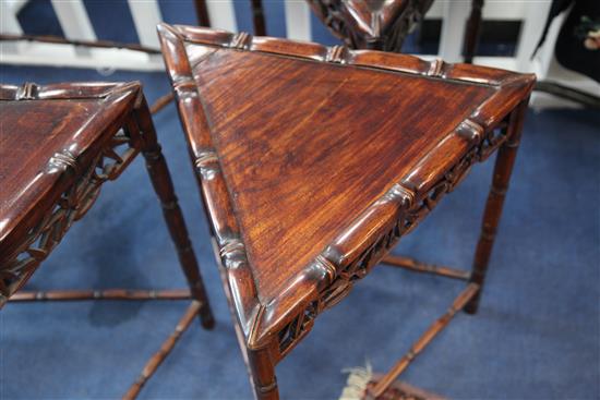 An unusual Chinese rosewood triangular shaped nest of quartetto tables, W.2ft